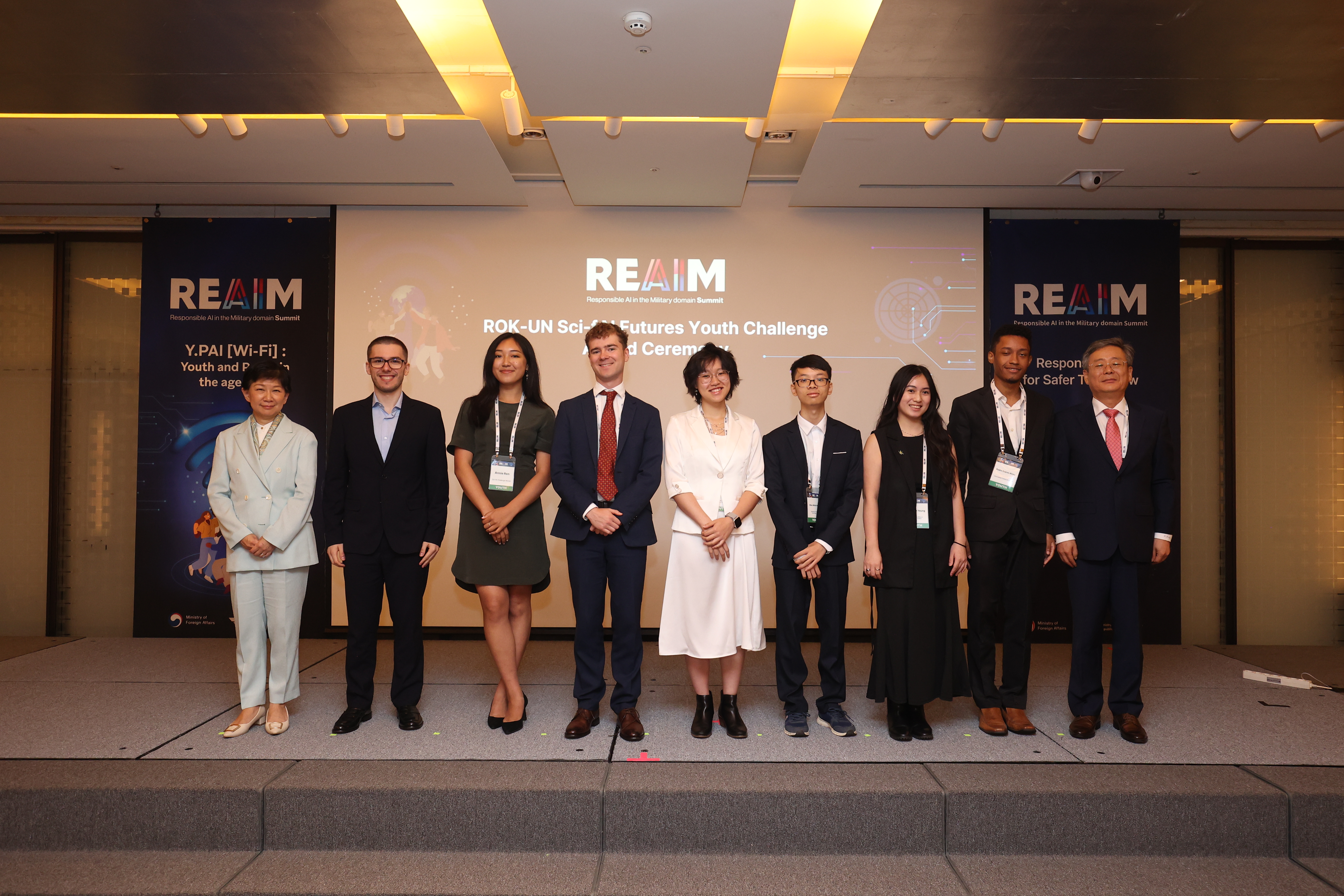 The author (Jord Nguyen, fourth from the right) at REAIM